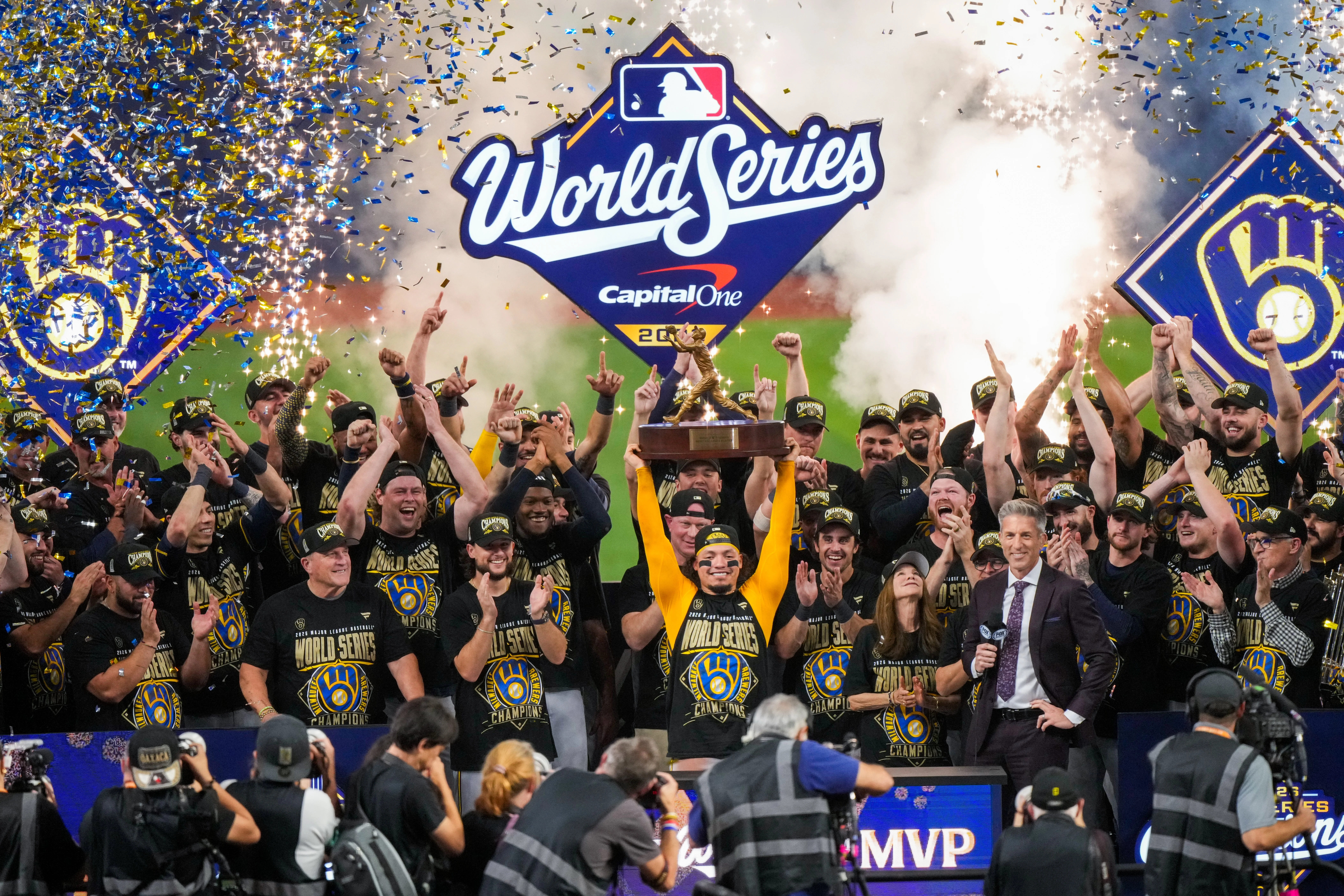 Milwaukee Brewers catcher William Contreras holds the MVP trophy after winning baseball