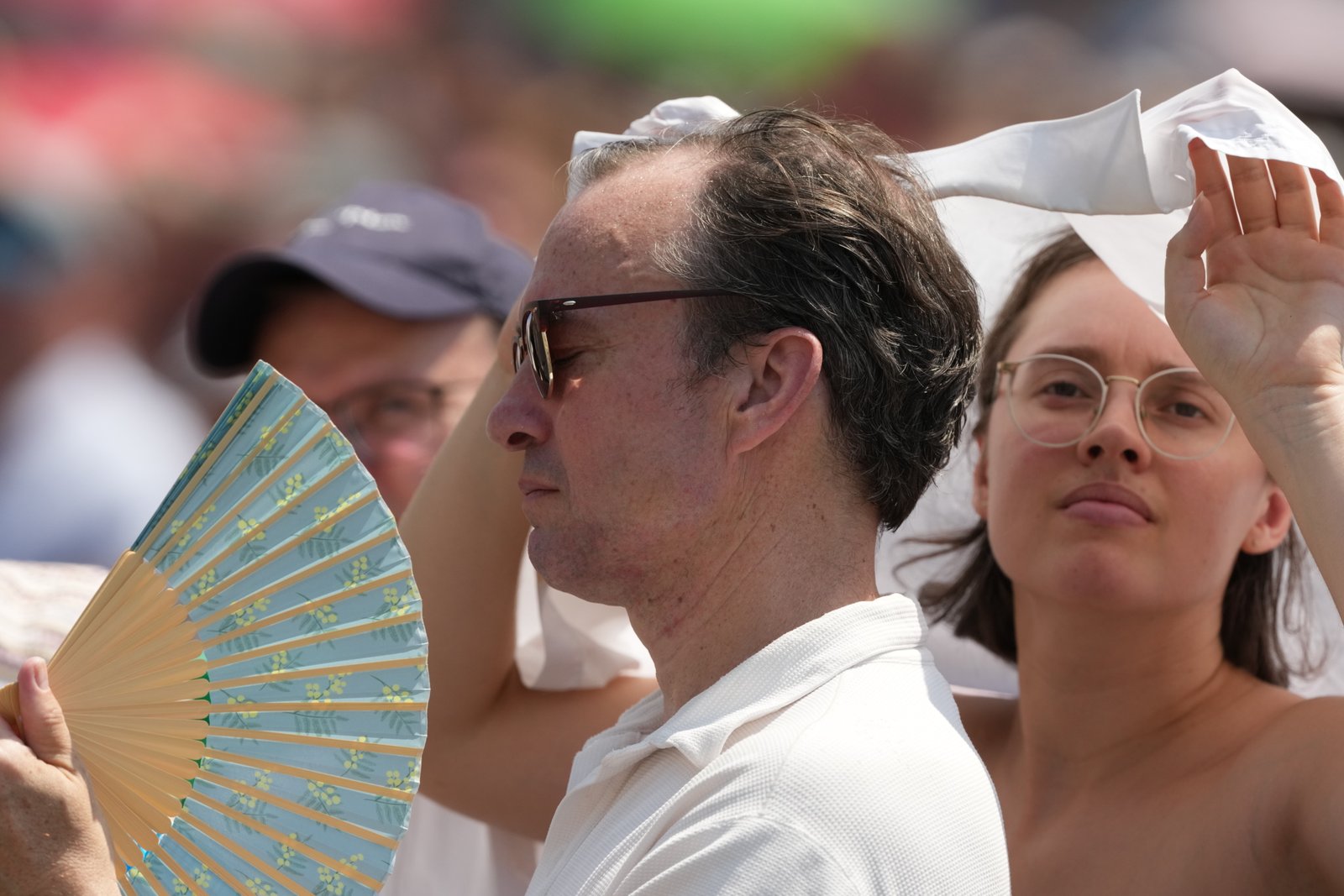 FILE - Faithful wait for the start of Pope Leo XIV Angelus prayer St. Peter