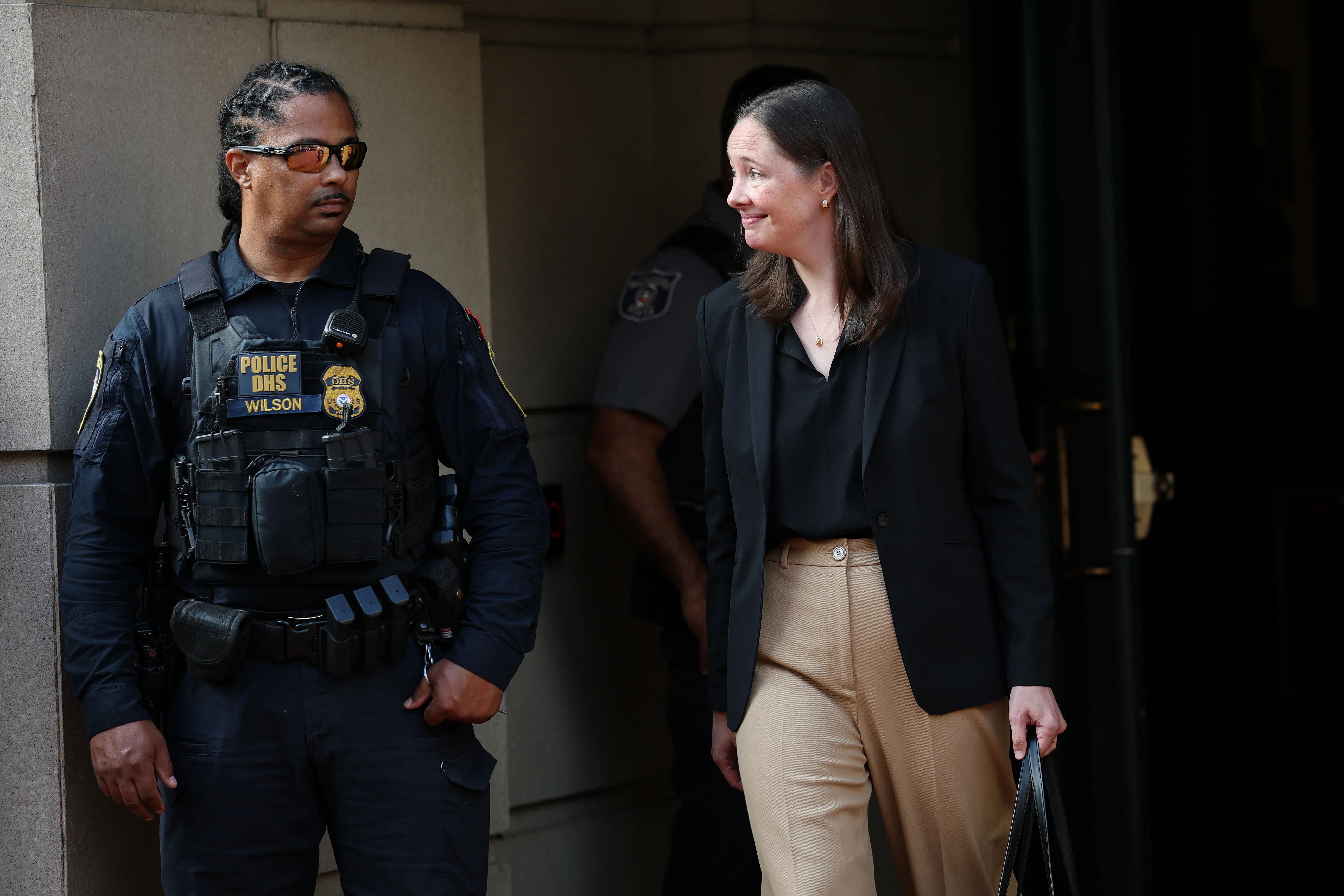 Maurene Comey (R), daughter of former FBI Director James Comey, departs a courthouse in October 2025 in Alexandria, Va.