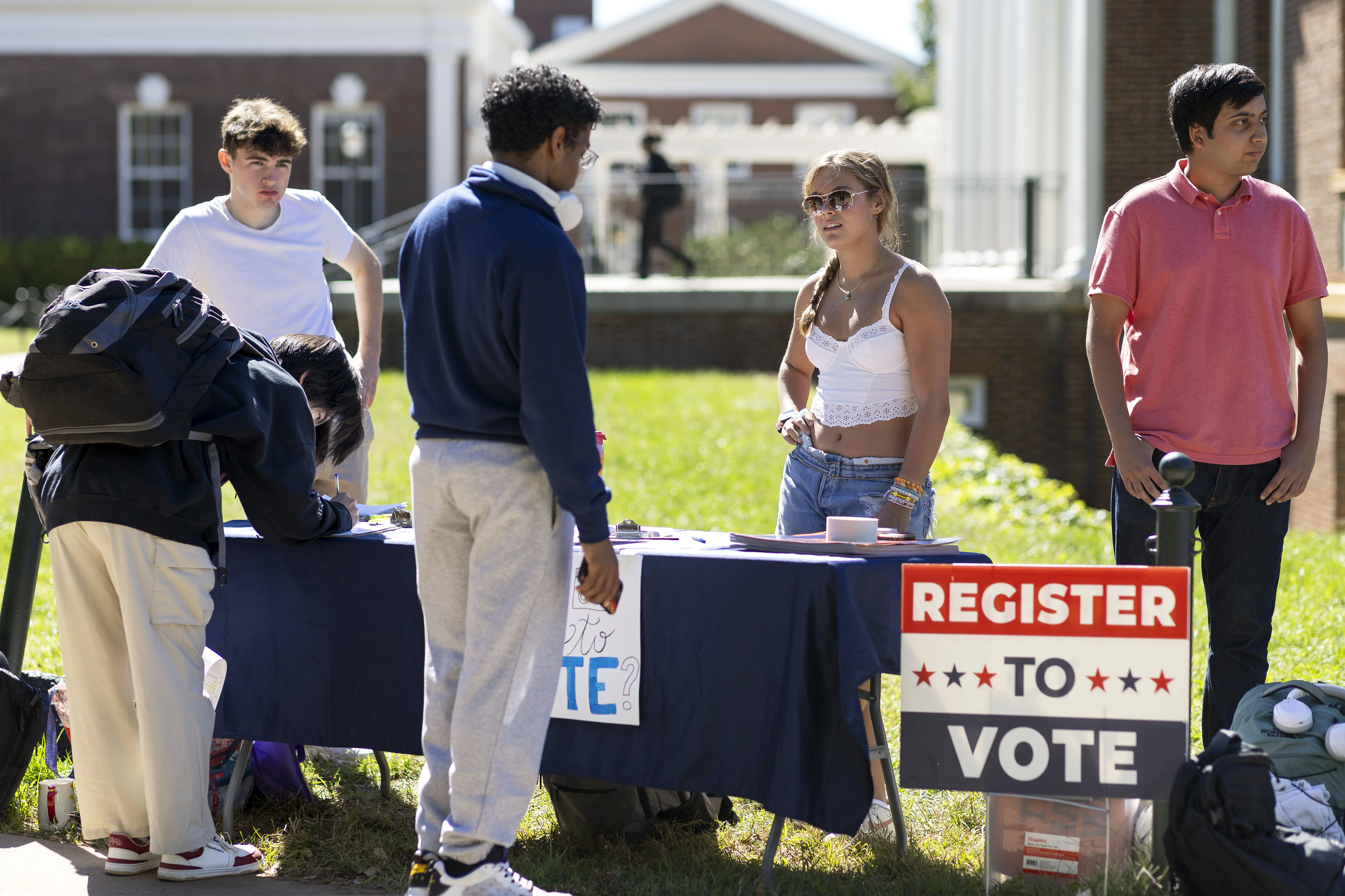 Students at the University of Virginia help eligible voters register to vote in Charlottesville, Va., in 2024.