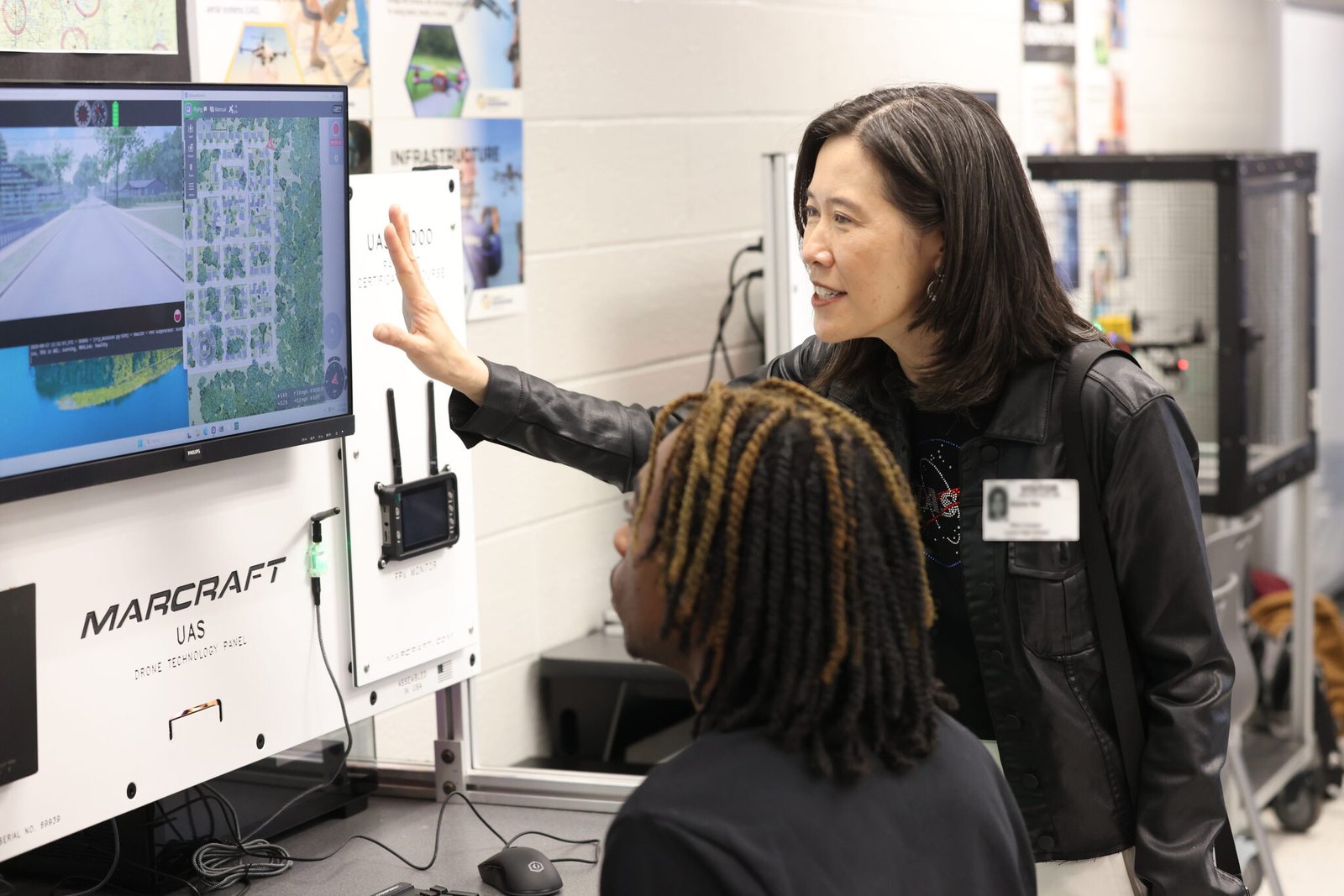 Two people looking at a computer screen