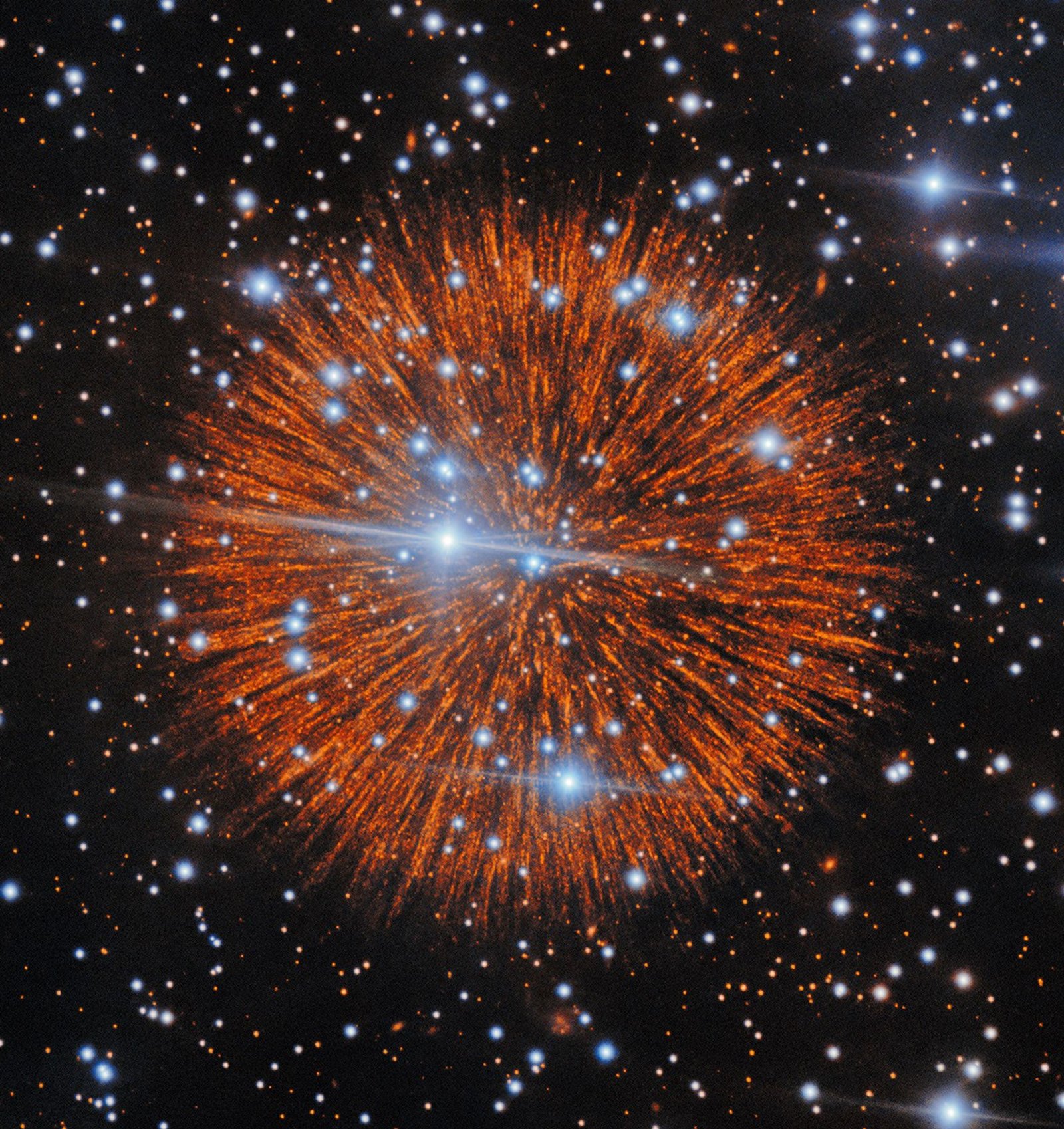 A red explosion extending radially like a firework over a dark field of stars.