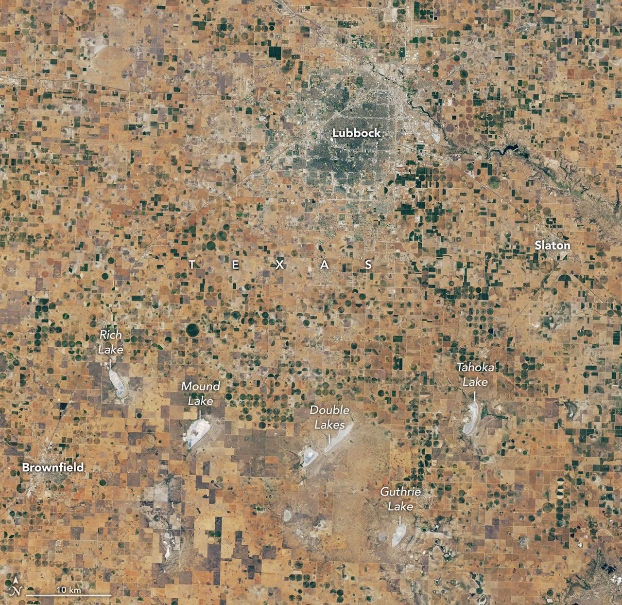 A satellite image of the same Lubbock region on September 9, 2026, appears parched, with much less green vegetation and mostly dry lakes.