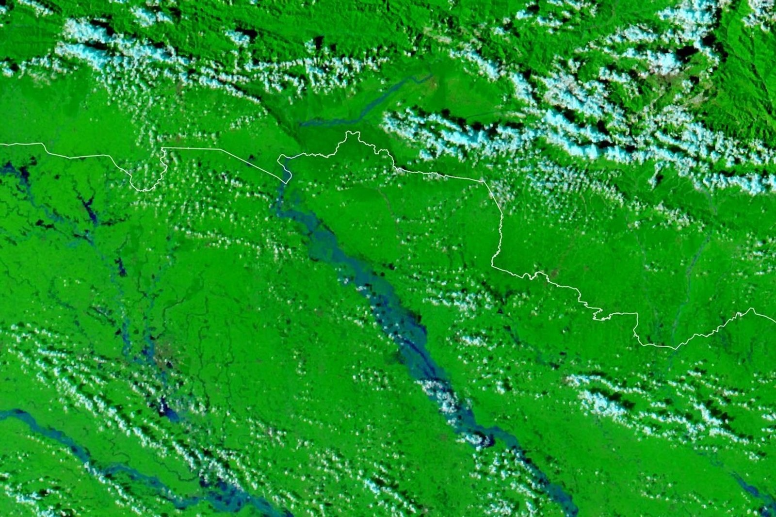 A false-color satellite image shows the same area during the flooding on September 29, 2026. The river appears much wider.
